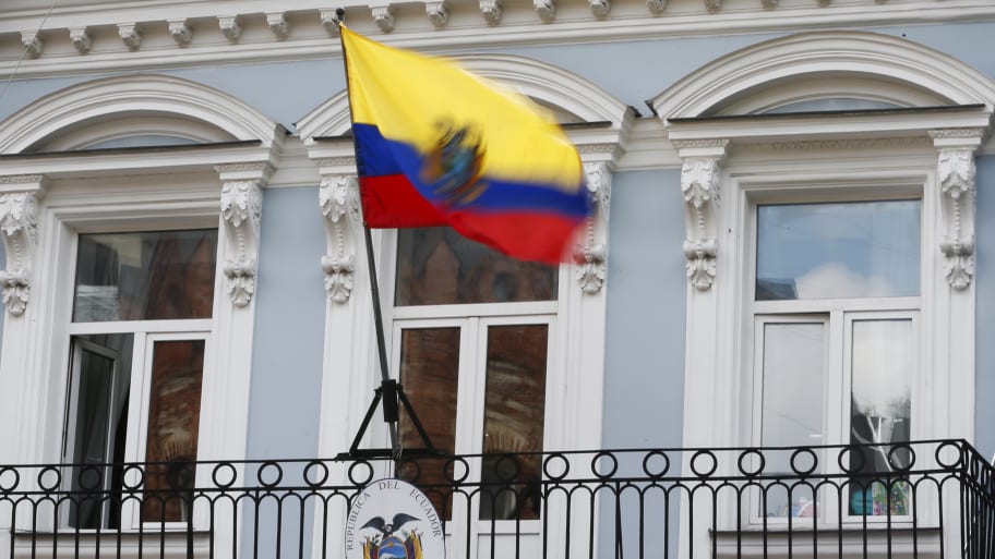 The national flag above the coat of arms is pictured at the embassy of Ecuador in Moscow, June 24, 2013. 