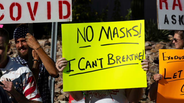 Protestors demonstrate a mask mandate in Tucson, Arizona