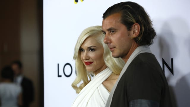 Cast member Gavin Rossdale and his wife Gwen Stefani pose at the premiere of "The Bling Ring" at the Director's Guild of America (DGA) theatre in Los Angeles, California June 4, 2013.