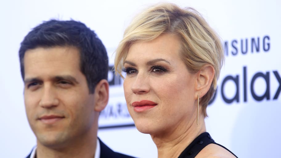 Molly Ringwald (right) and her husband Panio Gianopoulos (left) pose for photographers.