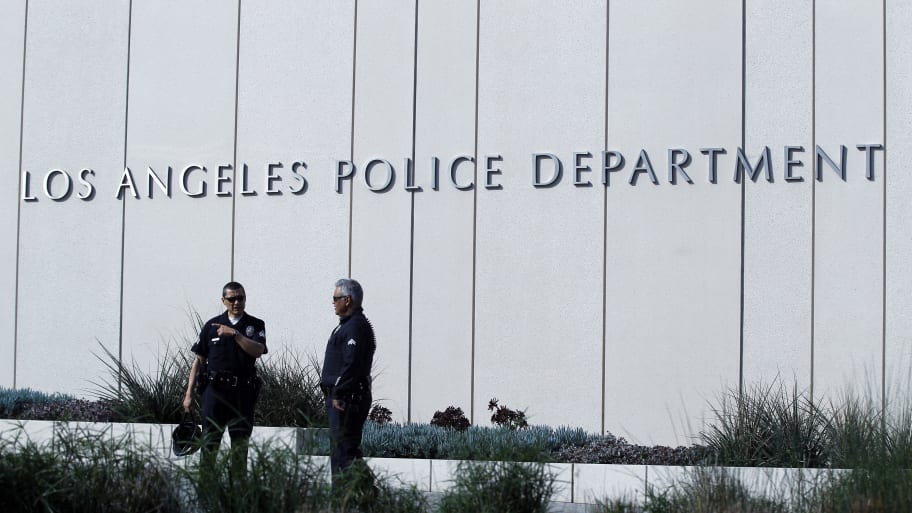 Police officers patrol outside LAPD headquarters in Los Angeles, California February 7, 2013.