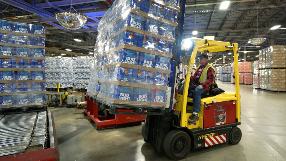 A forklift operator picks up a pallet of freshly wrapped Bud Light beer at the Anheuser-Busch brewery in Fort Collins, Colorado.