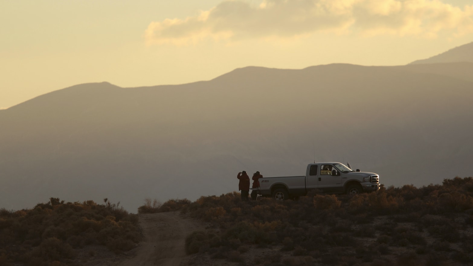 Sheriff’s deputies near an unmarked pickup truck in California’s Mojave Desert.