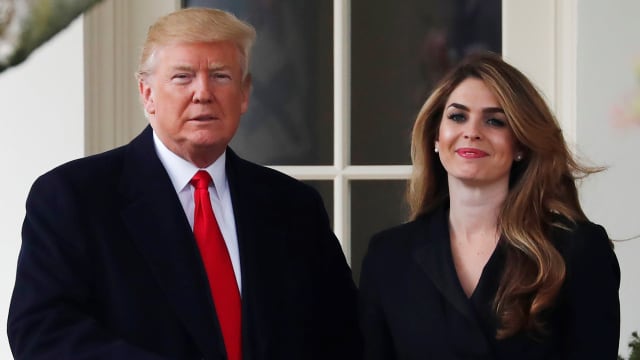 Donald Trump shakes hands with former White House Communications Director Hope Hicks outside of the Oval Office. 