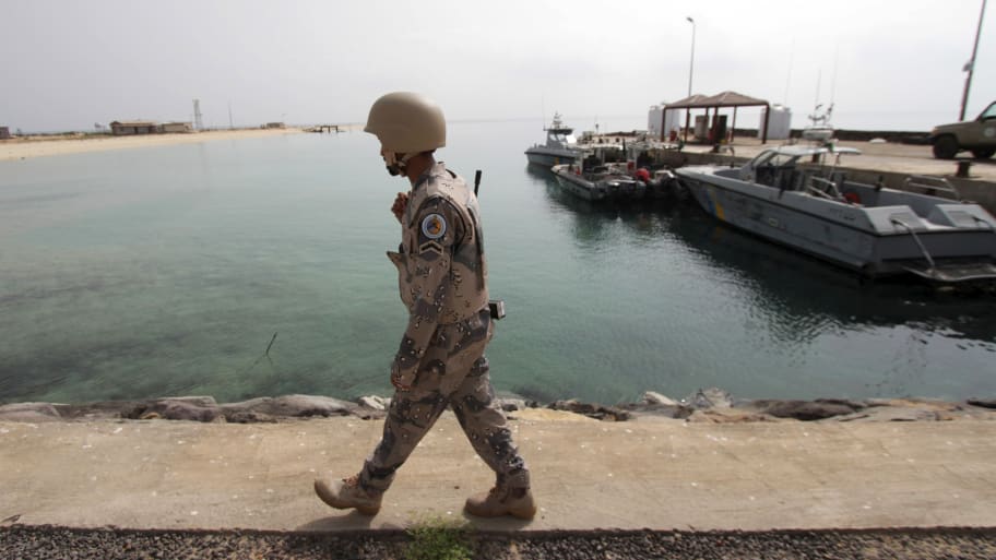 A Saudi border guard patrols Saudi Arabia’s maritime border with Yemen along a beach on the Red Sea, near Jizan, April 8, 2015.