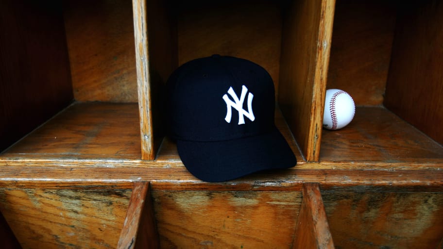 New York Yankees cap and a baseball