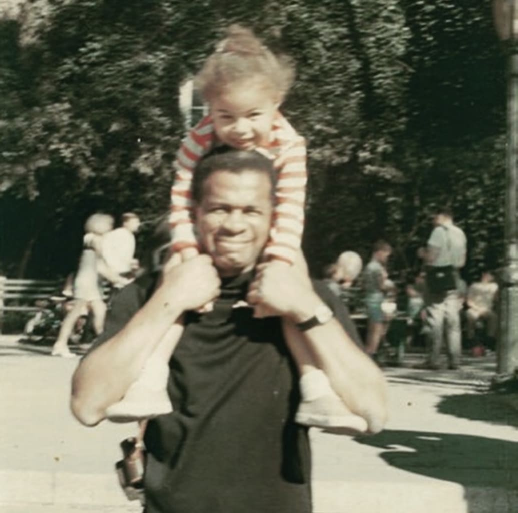 Jim Floyd holds his daughter Jami on his shoulders in 1967.