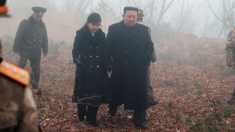 North Korean leader Kim Jong Un walks with his daughter Kim Ju Ae at an undisclosed location in this image released by North Korea’s Central News Agency (KCNA) on March 20, 2023.