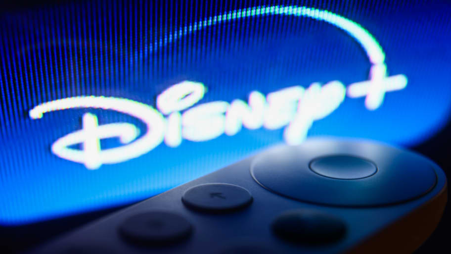 A picture of a Disney+ logo on Chromecast menu displayed on a TV screen. Disney is once again facing another lawsuit accusing the media giant of misleading investors by engaging in “a fraudulent scheme designed to hide the extent of Disney+ losses.”