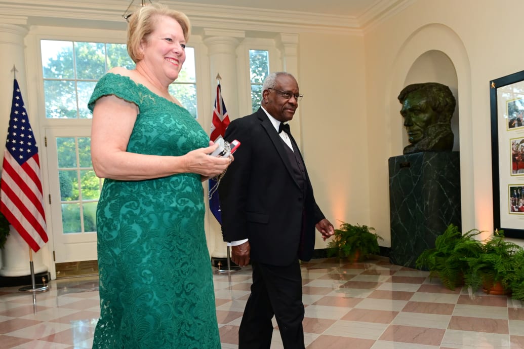 Supreme Court Justice Clarence Thomas arrives with his wife, Ginni Thomas.