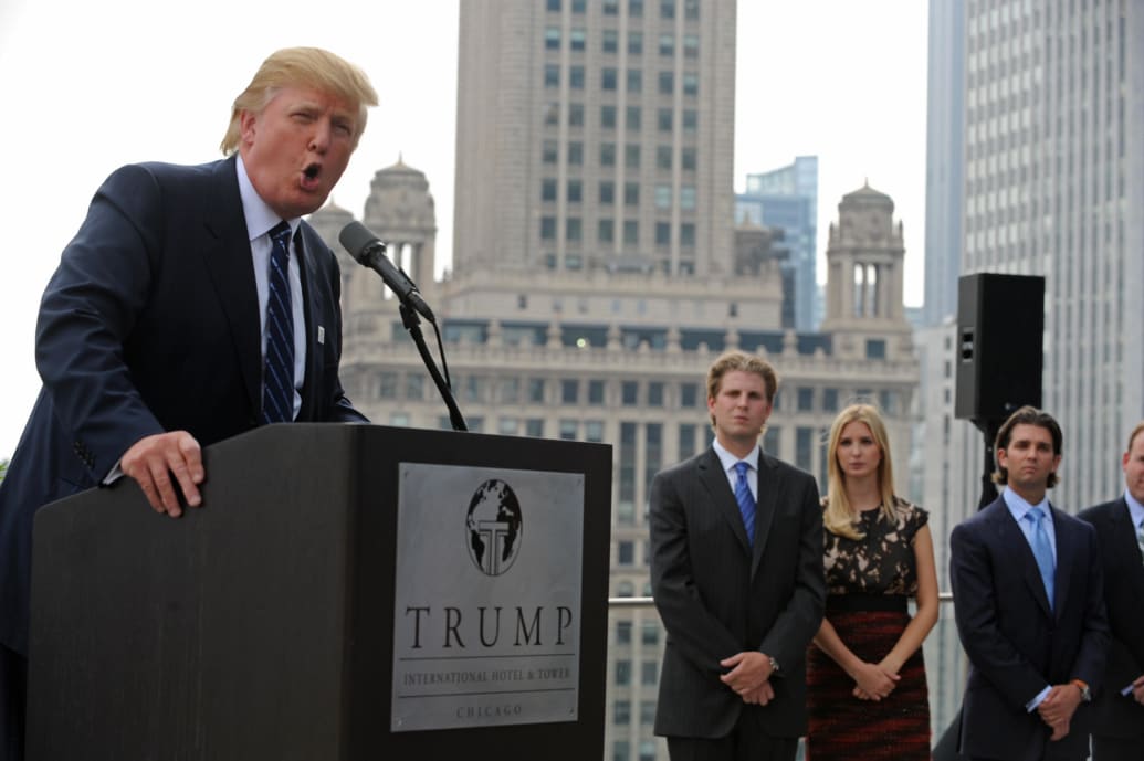 Real estate developer Donald Trump and his children Eric, Ivanka, and Donald Jr., attend a press conference at the Trump International Hotel and Tower in Chicago on September 24, 2008.