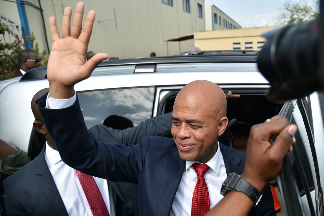 A picture of Michel Martelly waving to a crowd
