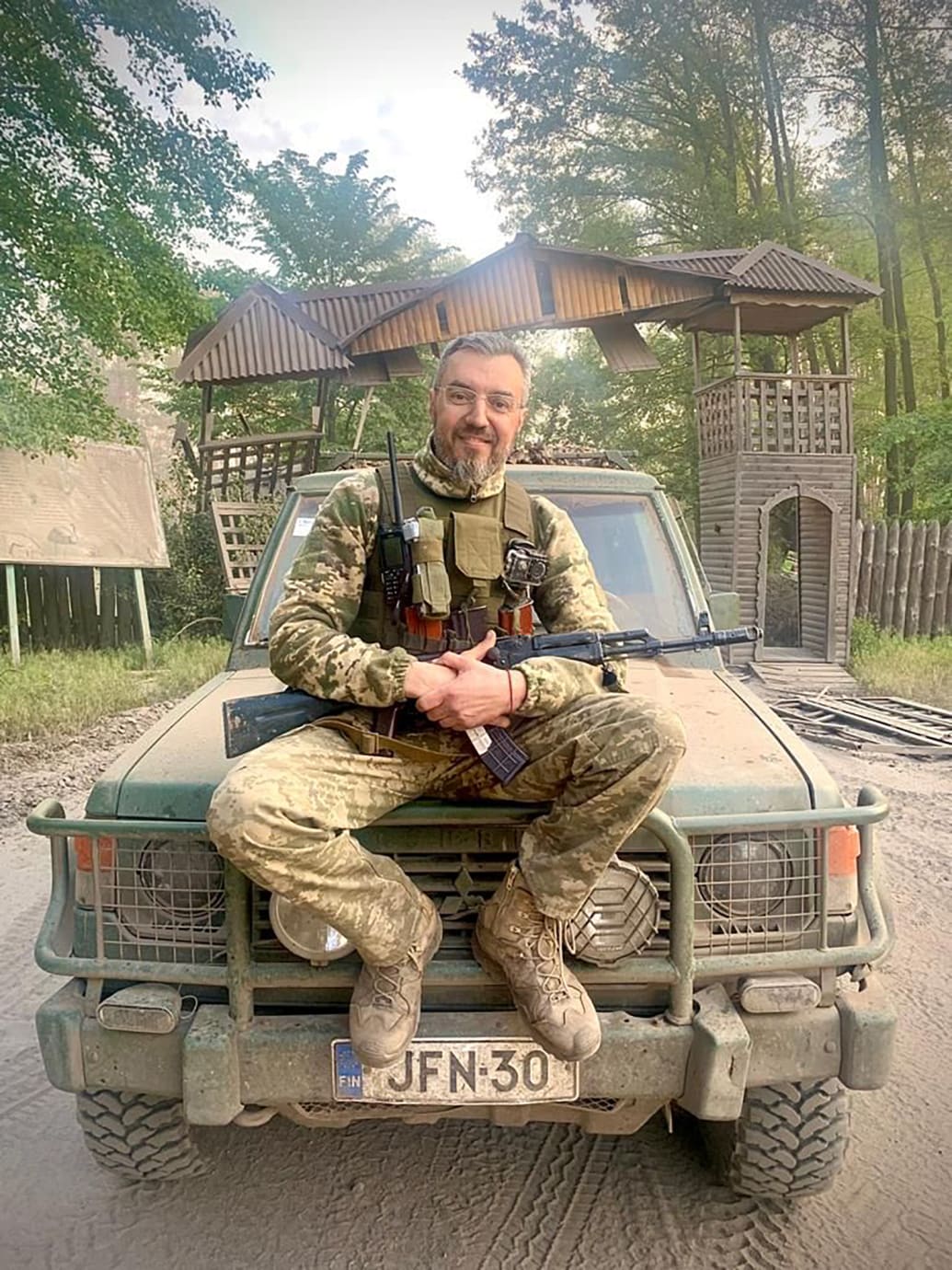 A photo of Ukrainian platoon commander Svyatoslav Dubina sitting on a utility vehicle in Ukraine.