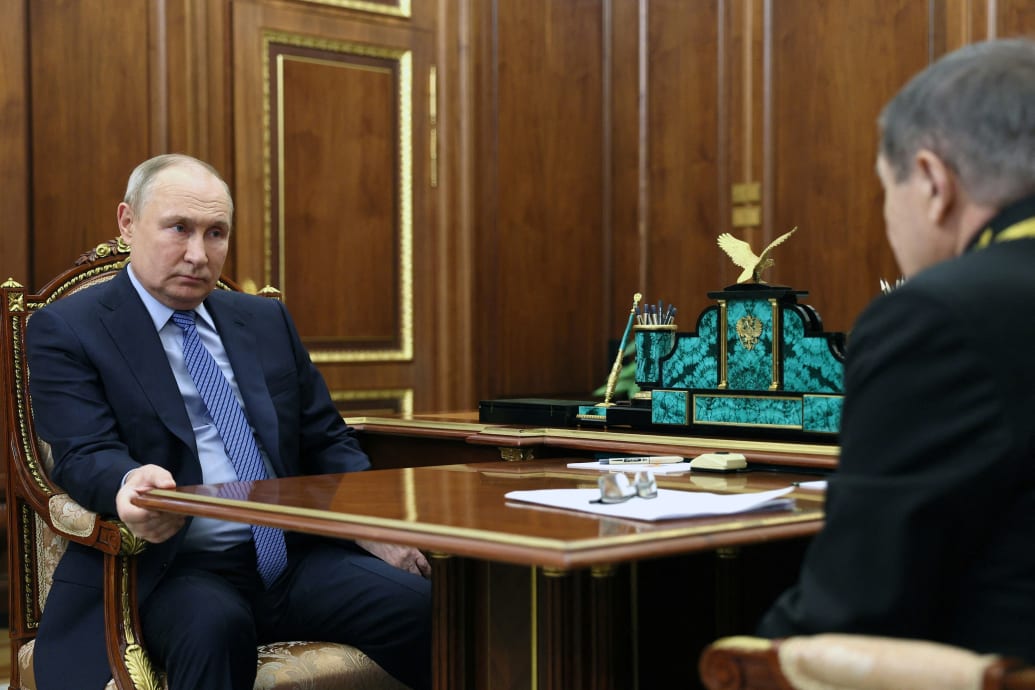 A picture of Vladamir Putin meeting with Vyacheslav Lebedev
