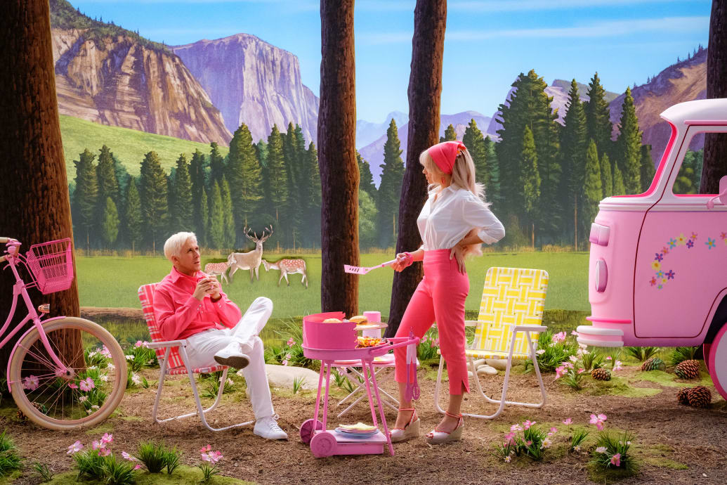 Ryan Gosling and Margot Robbie camping in a still from 'Barbie'