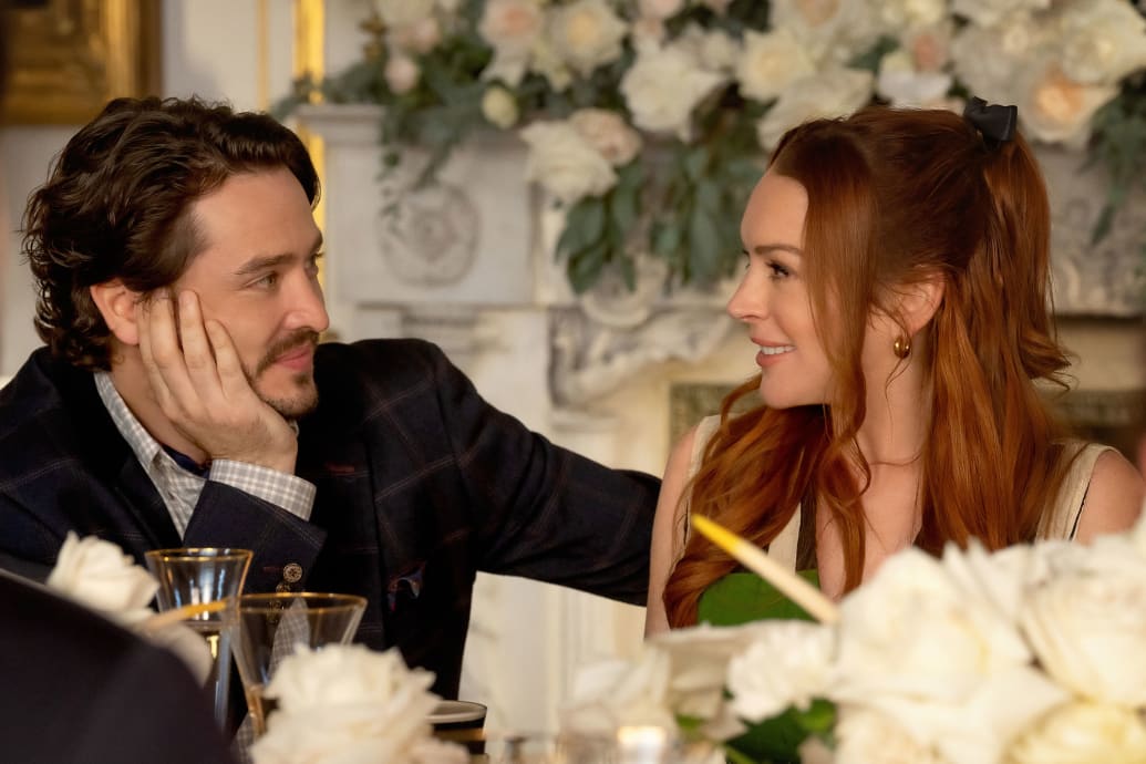 Alexander Vlahos and Lindsay Lohan look at each other in a still from ‘Irish Wish’