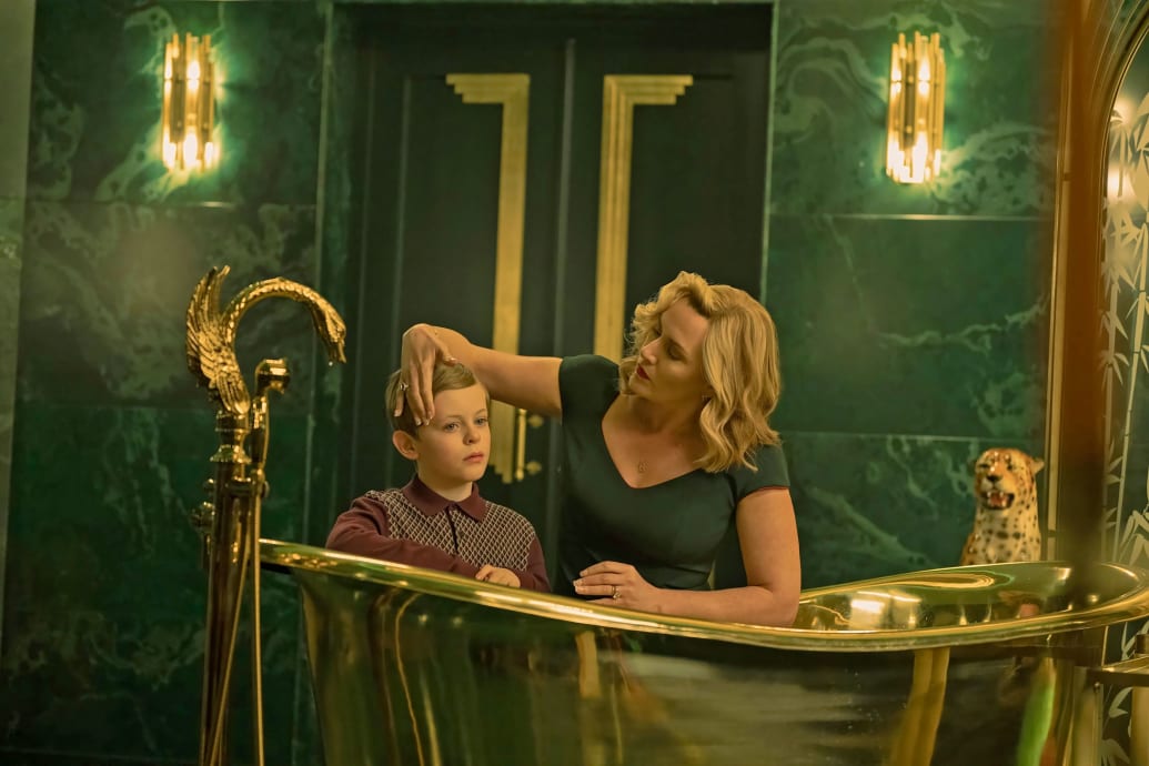 Kate Winslet gives Louie Mynett a bath in a still from 'The Regime'