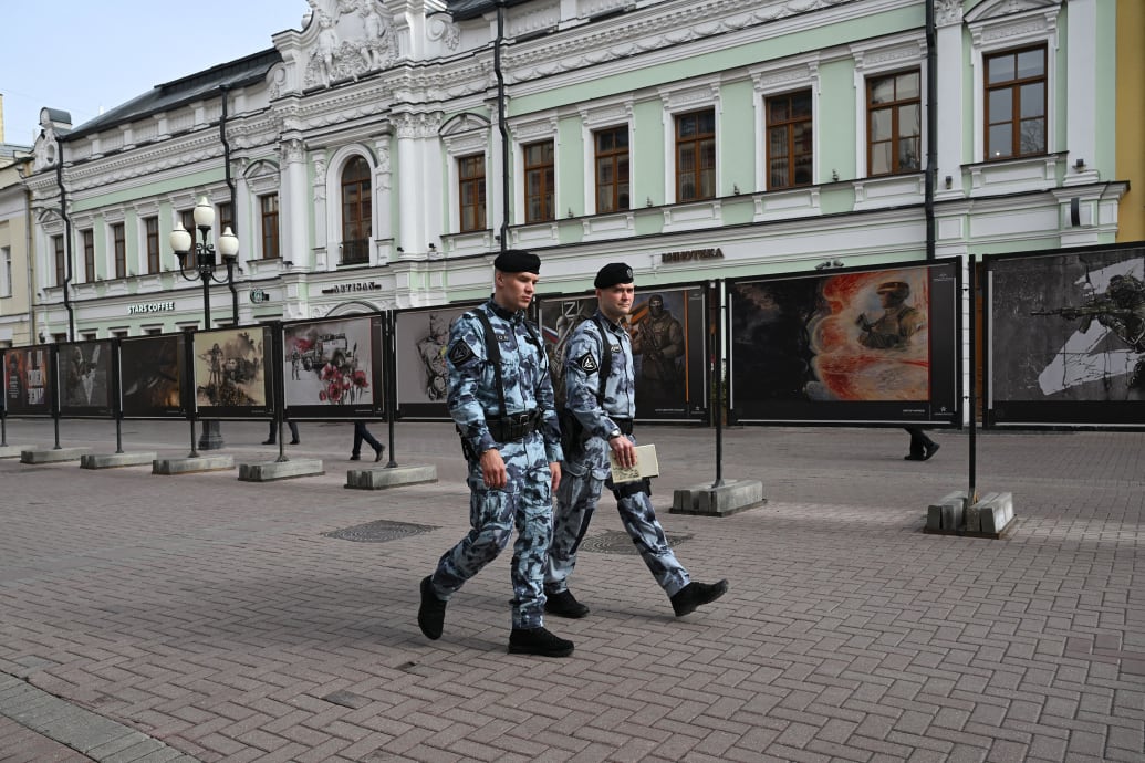 A photo of Russian police officers walking down the street in Moscow