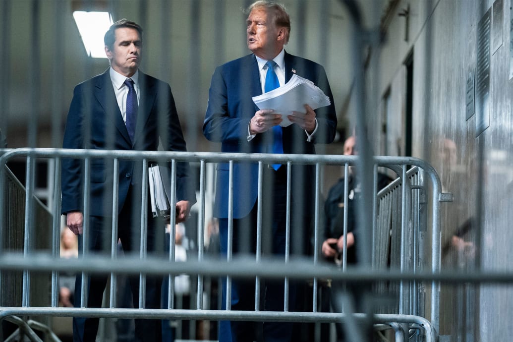 Donald Trump holds papers outside of Manhattan Criminal Court