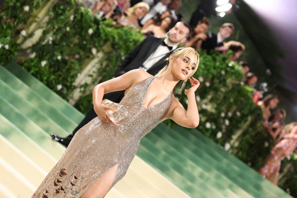 Camila Cabello poses on the carpet of the Met Gala.