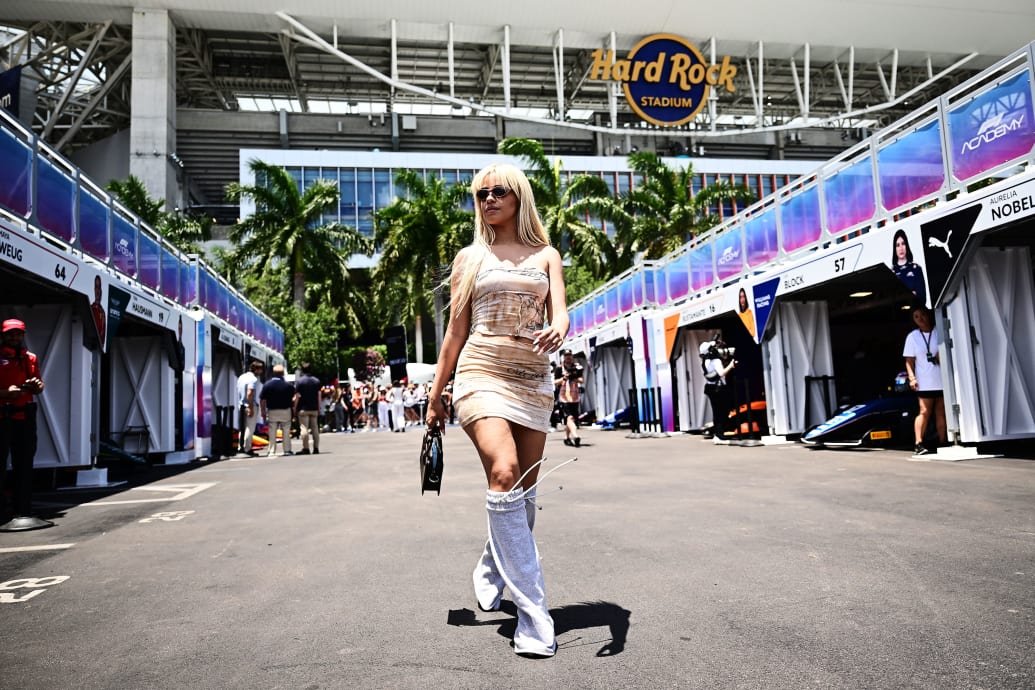 Camila Cabello walks in front of the Hard Rock Stadium at an F1 Academy race.