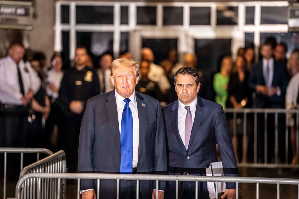 Donald Trump and Todd Blanche stand outside the Manhattan Criminal Court