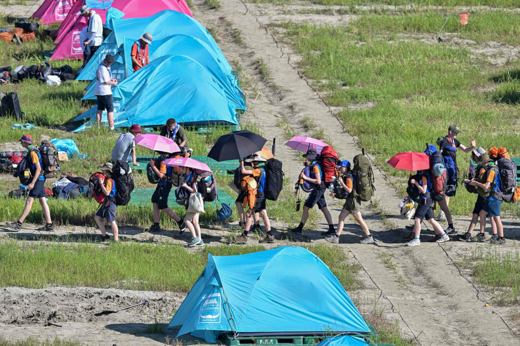 A picture of scouts leaving their campsite at the World Scout Jamboree