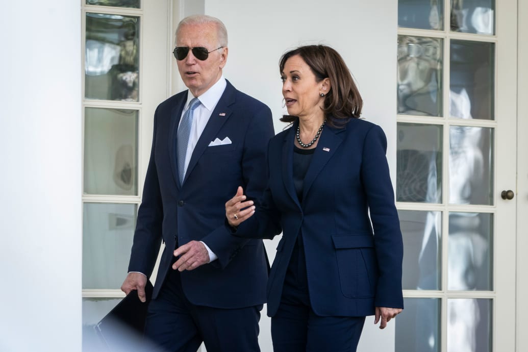 A picture of Joe Biden and Kamala Harris walking outside the Oval Office