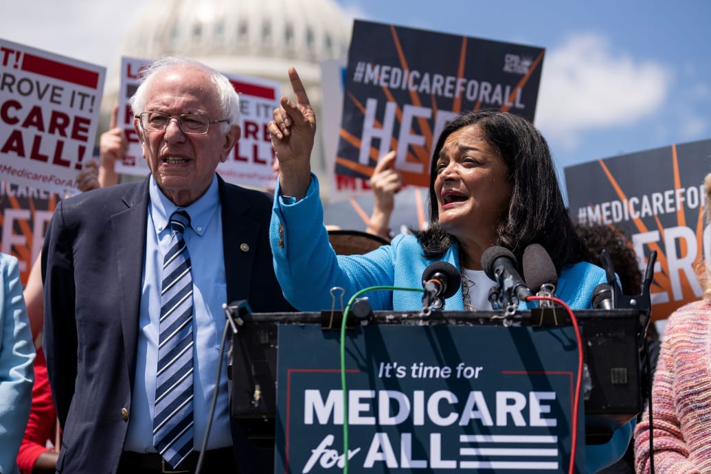 A picture of Senators Bernie Sanders and Pramila Jayapal at a news conference outisde of the capital