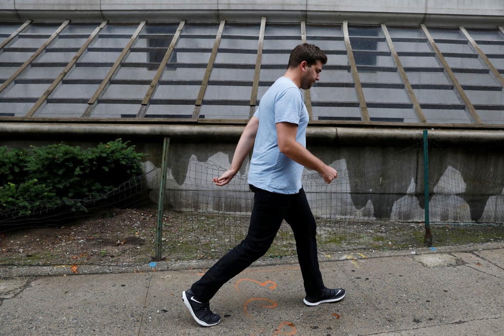 A photo of Billy McFarland walking outisde of U.S. Federal Court