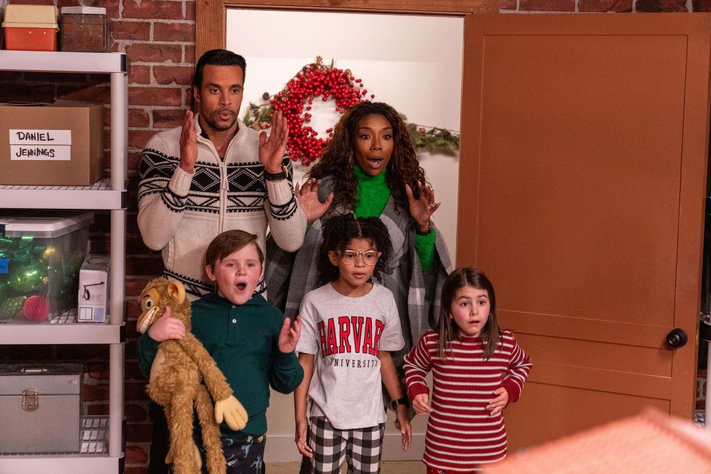 Matt Cedeno, Wyatt James Hunt, Madison Validum, Brandy Norwood, and Abby Villasmil stand next to each other in surprise in a still from Best Christmas Ever