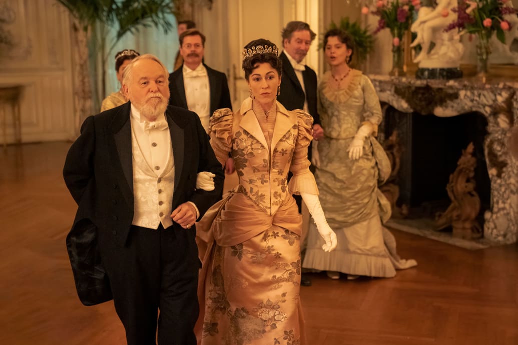 Dakin Matthews and Kelley Curran walk arm in arm in a still from 'The Gilded Age'
