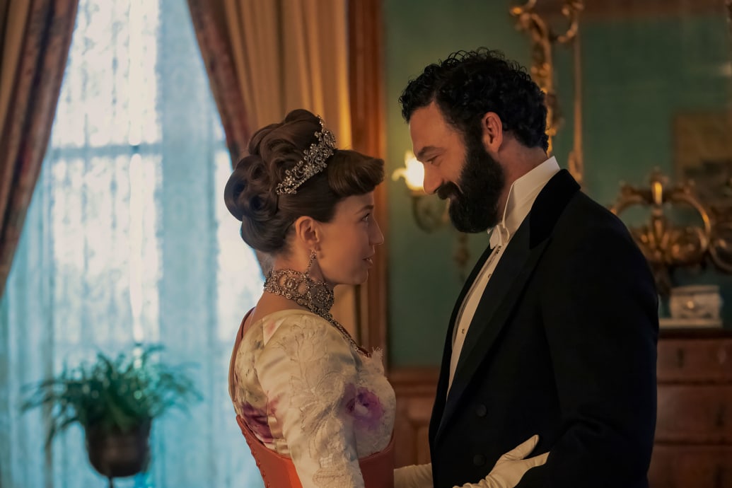 Carrie Coon and Morgan Spector hug in a still from 'The Gilded Age'
