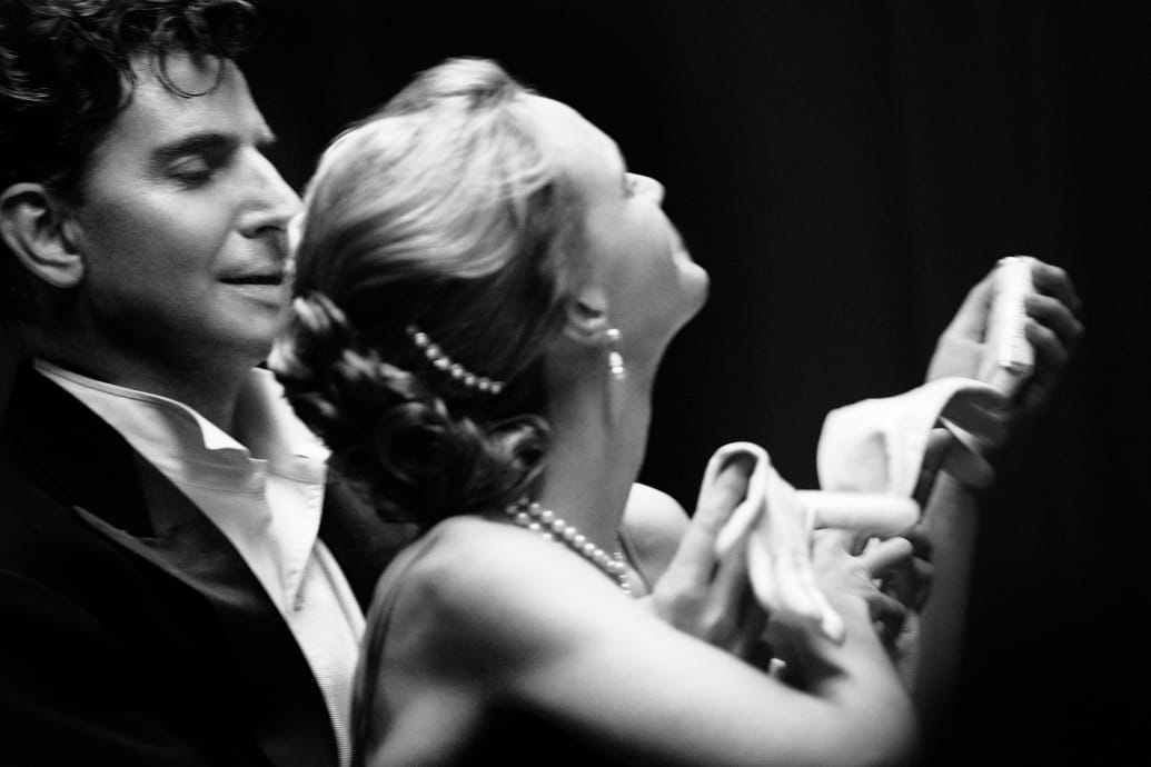 Bradley Cooper and Carey Mulligan dance together in a black and white still from ‘Maestro’