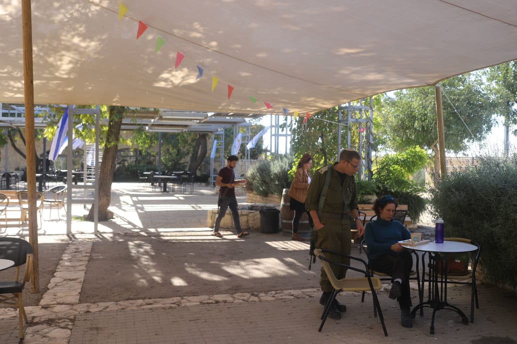 Israelis sitting in Susya in the West Bank.