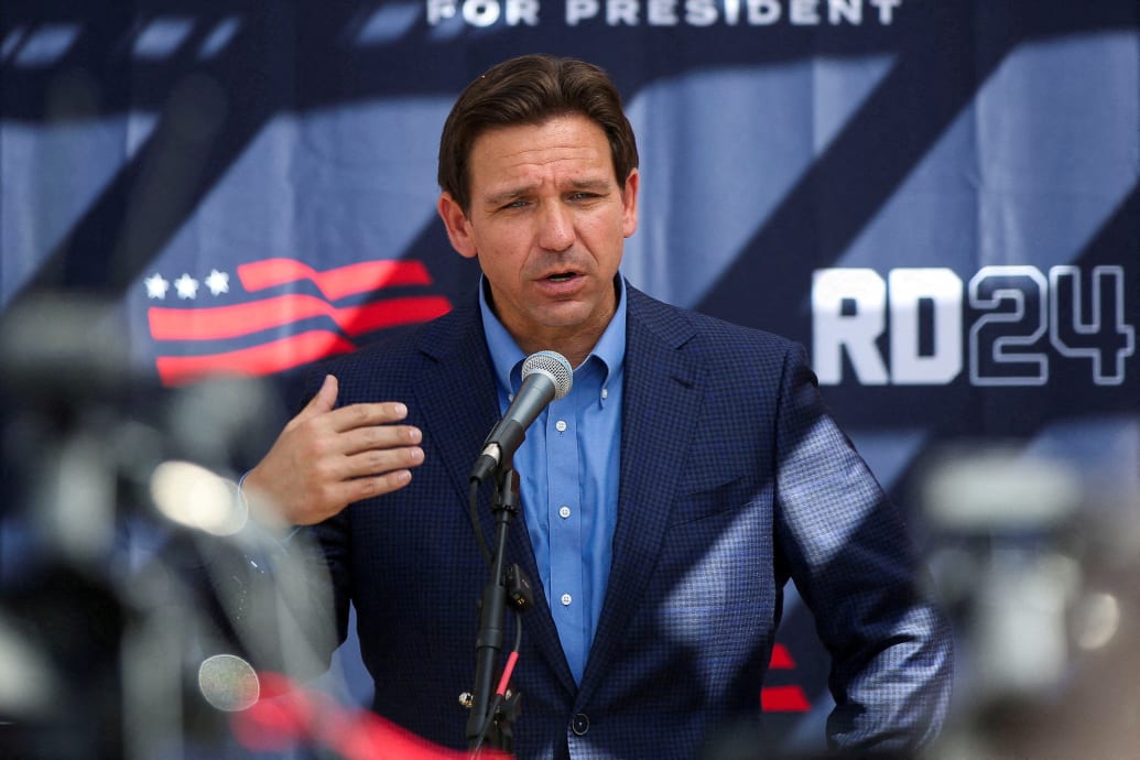 Florida Governor and Republican U.S. presidential candidate Ron DeSantis attends a barbecue hosted by former diplomat Scott Brown