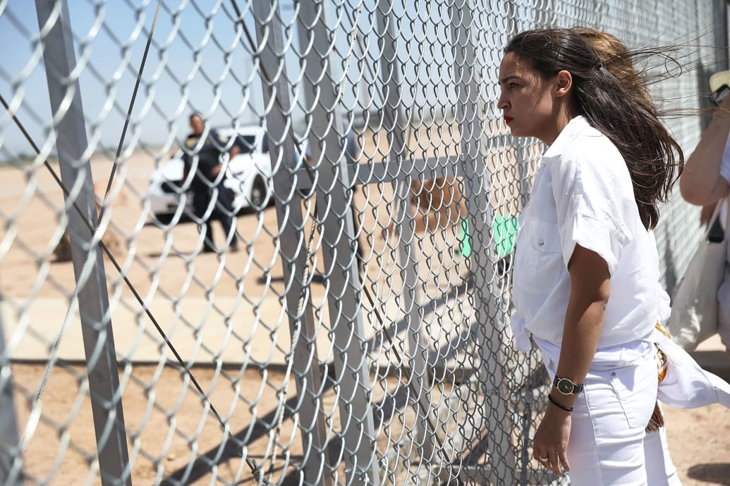 A photograph of Alexandria Ocasio-Cortez at the U.S. border entry gate on June 24, 2018 in Tornillo, Texas as a protest against the government’s immigration policy of separating children from their parents.