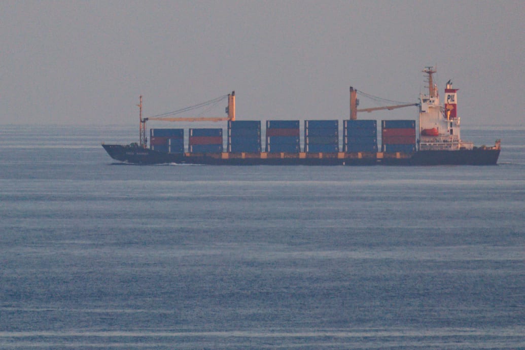 A photograph of the container ship, Kota Rahmat - with the destination 'VSL NO LINK ISRAEL' - approaching the Bab-el-Mandeb strait on January 18, 2024 in Obock, Djibouti.