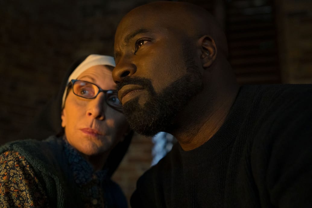 A photo still of Andrea Martin and Mike Colter
