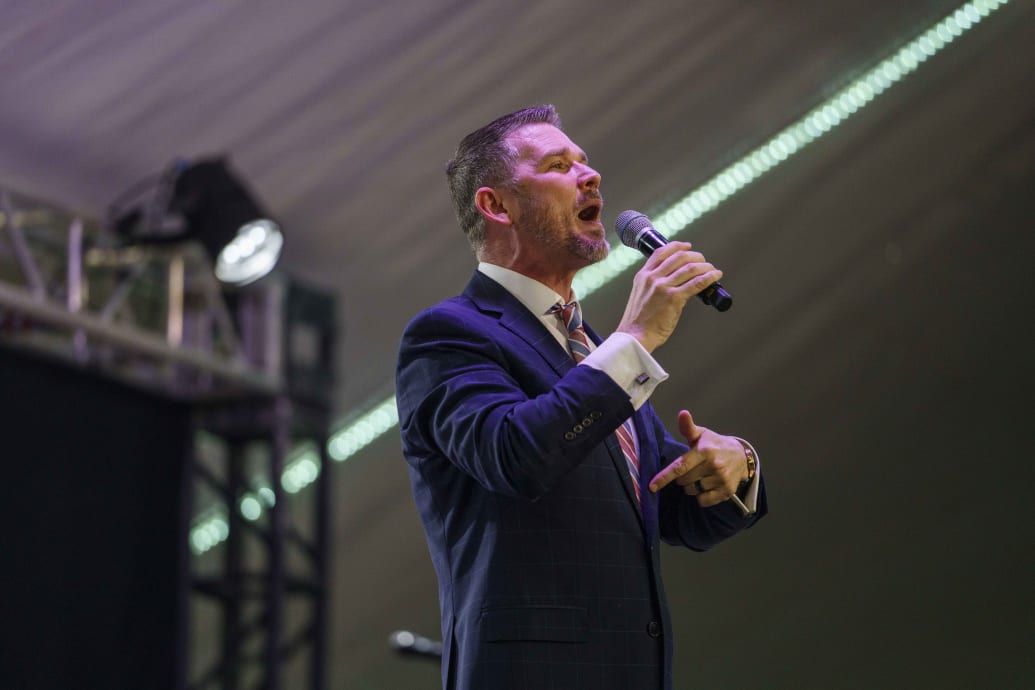 Pastor Greg Locke, the pastor of the controversial Global Vision Bible Church, preaches from the stage inside the tent on Sunday March 6, 2022.