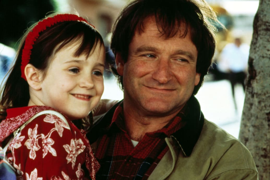 A close up shot of Mara Wilson being held by Robin Williams in ‘Mrs. Doubtfire’