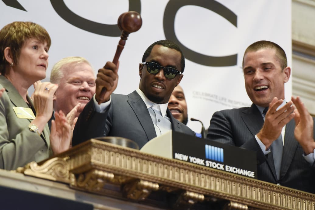 (L-R) President Diageo North America Dierdre Mahlan, Sean 'Diddy' Combs and President NYSE Group Tom Farley ring the NYSE Closing Bell at New York Stock Exchange in 2016.