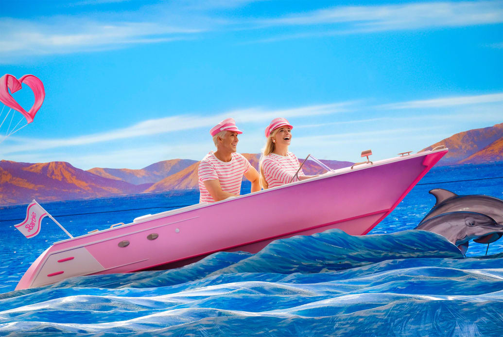 Ryan Gosling and Margot Robbie riding a boat in a still from 'Barbie'