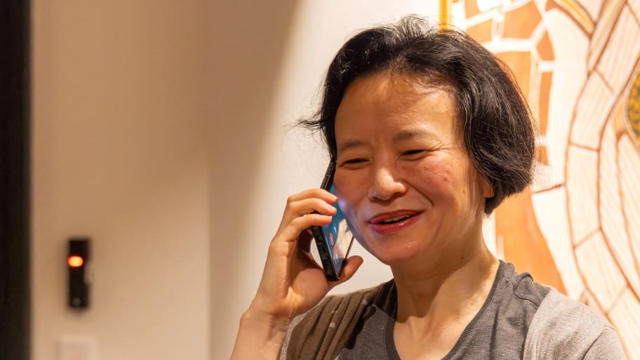 Australian journalist Cheng Lei speaks on the phone, on arrival at Melbourne Airport in Melbourne, October 11, 2023.