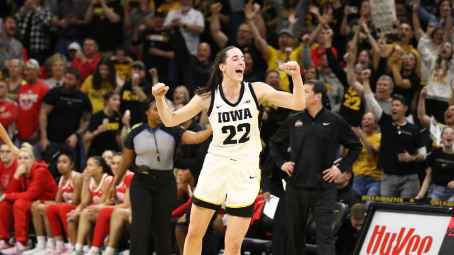 Guard Caitlin Clark #22 of the Iowa Hawkeyes celebrates after breaking Pete Maravich's all-time NCAA scoring record