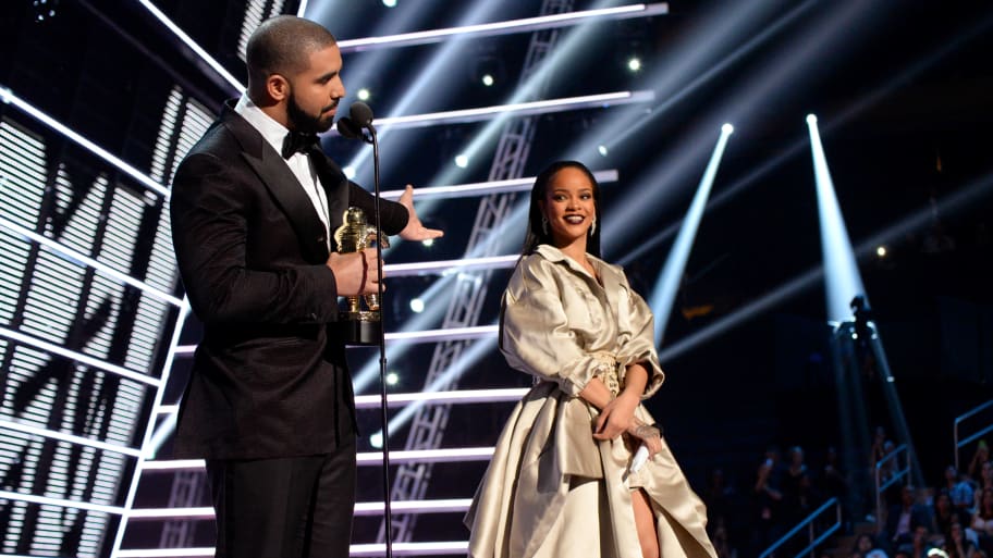 Drake presenting Rihanna with an award at The 2016 VMAs