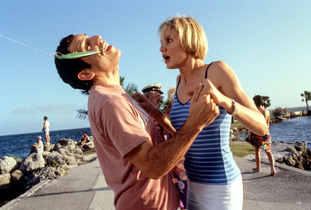 Ben Stiller throws his head back with a fishhook as Cameron Diaz watches the action in the film 