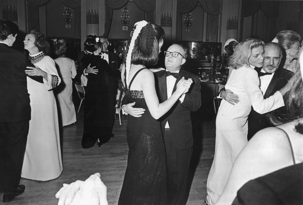 A black and white photo of Truman Capote dancing with Wendy Vanderbilt at his Black and White Ball
