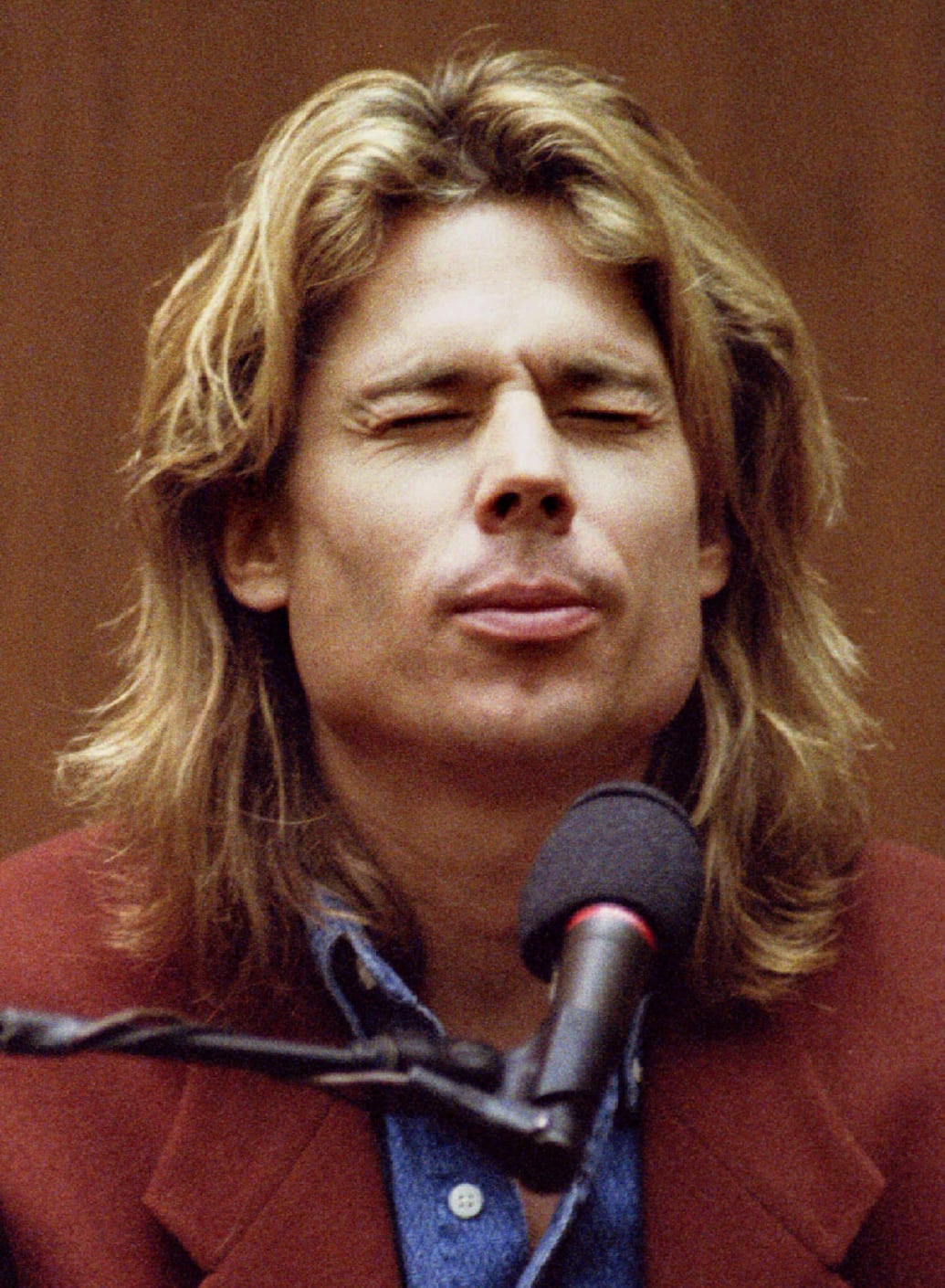 Brian ‘Kato’ Kaelin closes his eyes and grimaces as he thinks about his answer during cross examination in the O.J. Simpson trial.