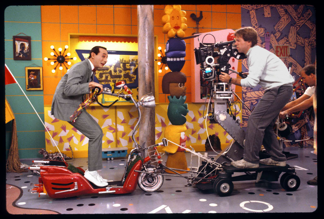 Publicity still from the children's television show 'Pee Wee's Playhouse' (CBS) shows star Paul Reubens and cinematographer Daryl Studebaker, 1986.